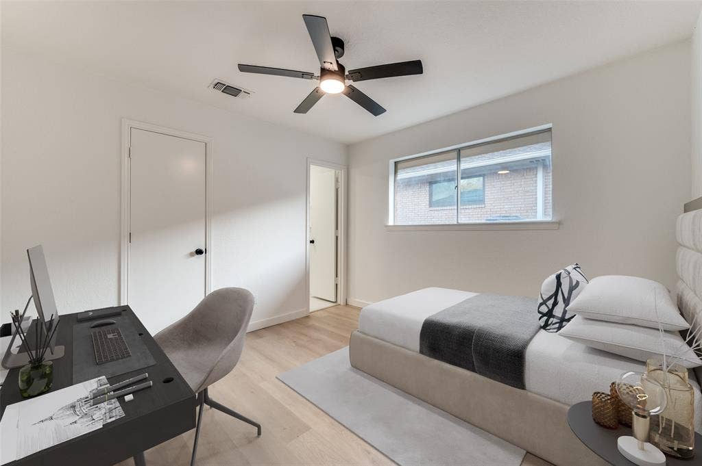 2601 Red Oak Lane, Plano, TX 75075 Comfortable secondary bedroom with modern fan and direct access to updated guest bath.
