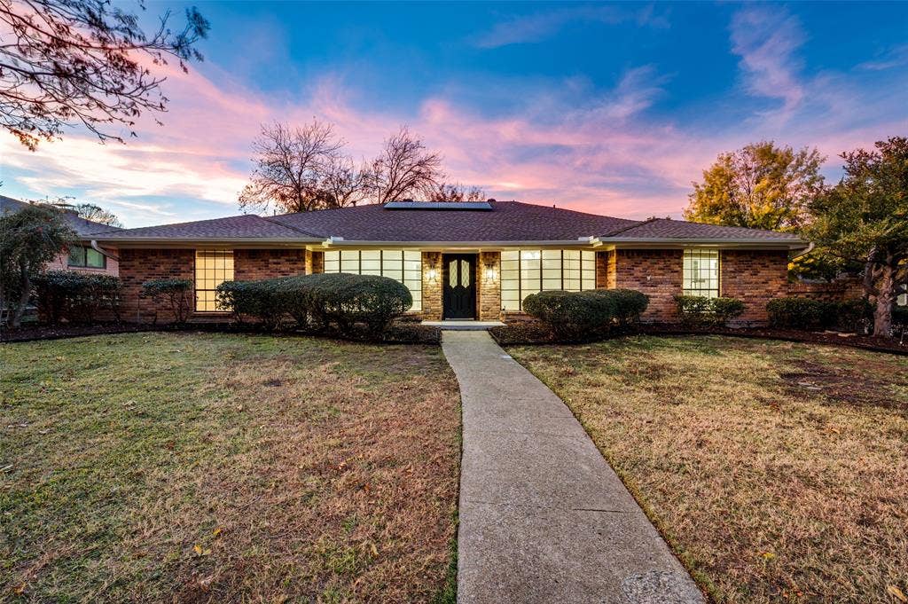 2601 Red Oak Lane, Plano, TX 75075 Corner-lot brick home with oversized bay windows and inviting curb appeal. Major structural upgrades include foundation work with transferable lifetime warranty and fully owned solar panels that convey.