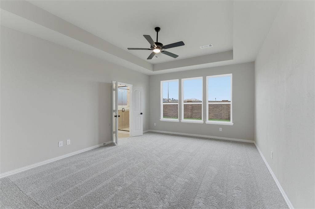 15056 Green Bluff Drive, Aledo, TX 76008 Spacious room featuring light gray carpeting and neutral wall tones