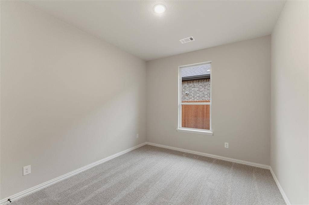 15056 Green Bluff Drive, Aledo, TX 76008 Room featuring light gray carpet flooring, neutral painted walls, and white trim