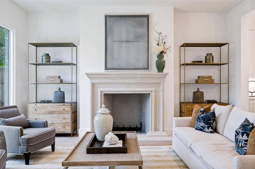 4635 Lorraine Avenue, Highland Park, TX 75209 Warm Den is centered around a custom gas fireplace with cast stone mantle & surround.
