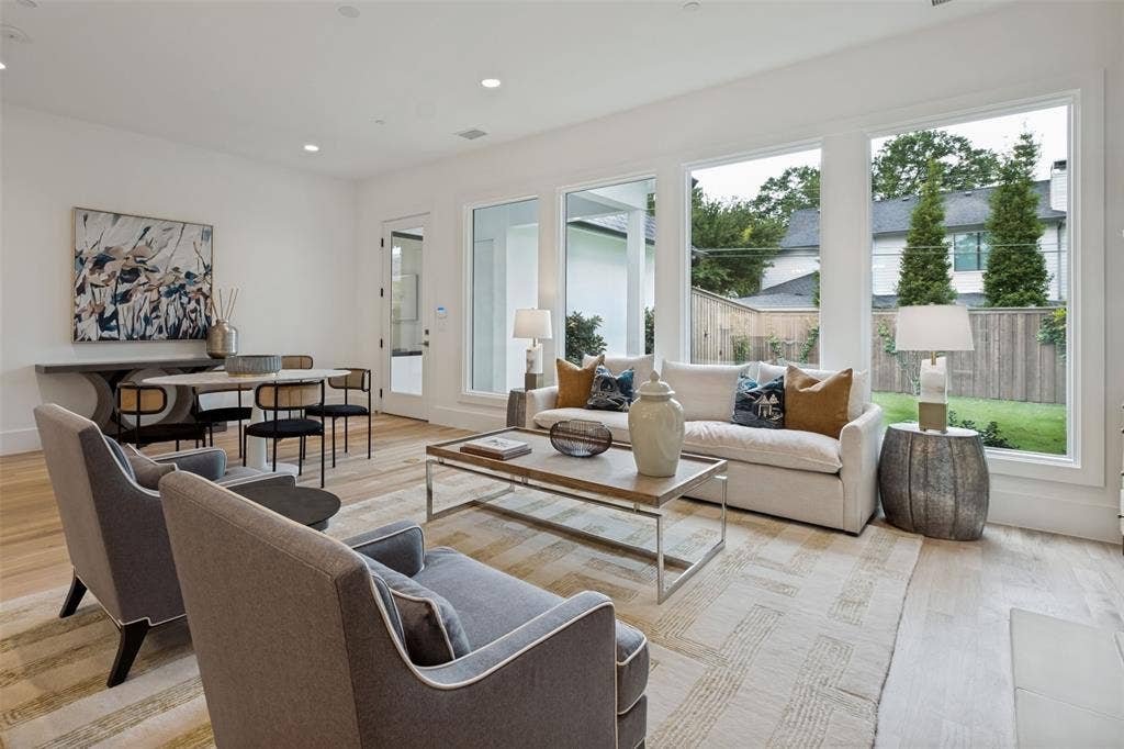 4635 Lorraine Avenue, Highland Park, TX 75209 The expansive wall of windows allows abundant natural light with views of the pool sized landscaped yard with an 8' privacy fence