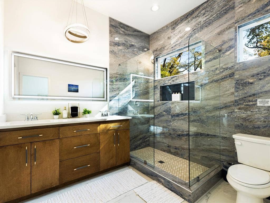 6221 Inca Drive, Mabank, TX 75156 Full bathroom with a tile shower, double vanity, and recessed lighting