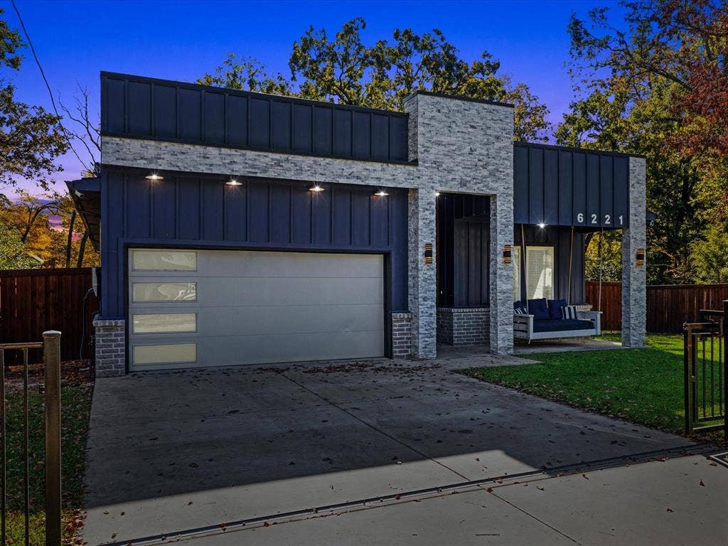 6221 Inca Drive, Mabank, TX 75156 View of front of house with board and batten siding, concrete driveway, and a garage