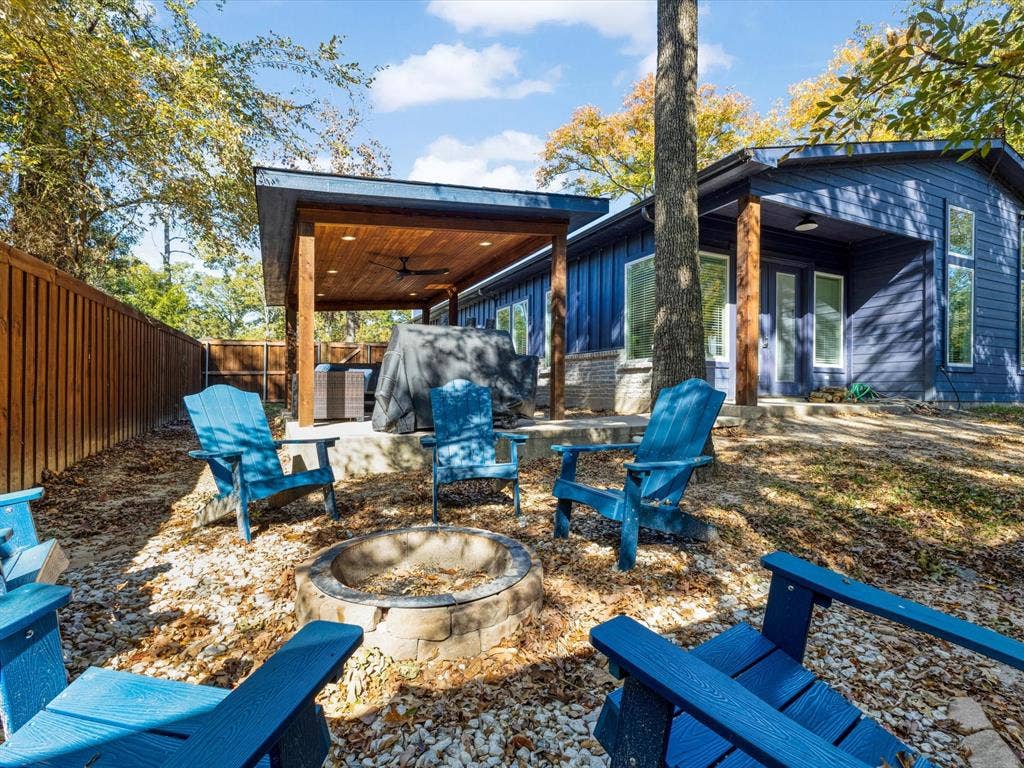 6221 Inca Drive, Mabank, TX 75156 Fenced backyard with a ceiling fan, an outdoor fire pit, a patio area, and grilling area