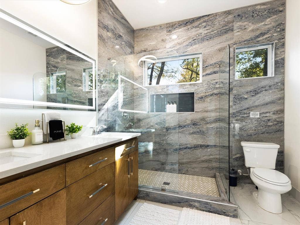 6221 Inca Drive, Mabank, TX 75156 Bathroom with a tile shower and double vanity