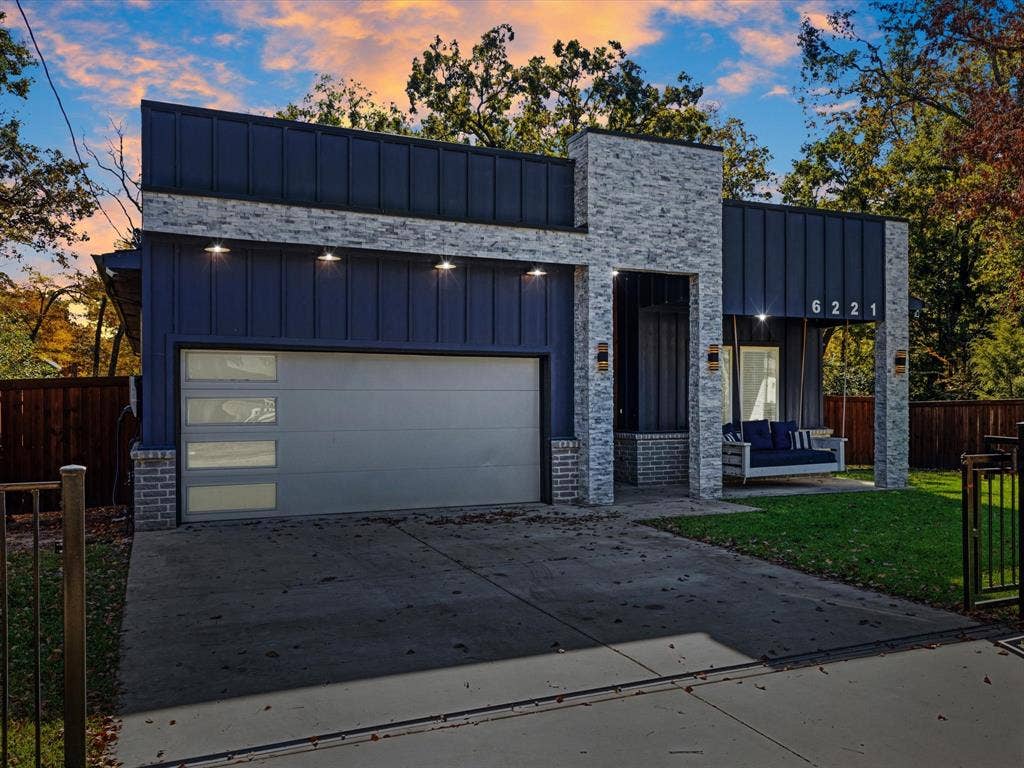 6221 Inca Drive, Mabank, TX 75156 View of front of property featuring board and batten siding, driveway, and a garage