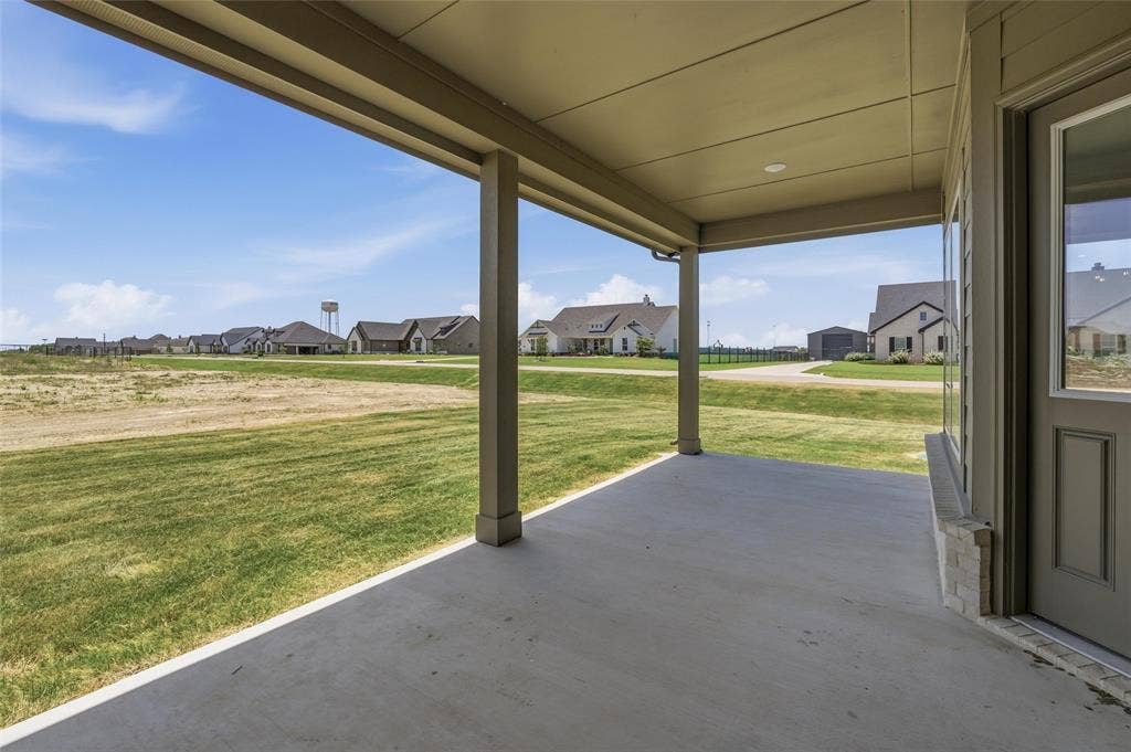 12117 Clastic Court, Krum, TX 76249 Covered patio featuring a concrete slab and painted support columns