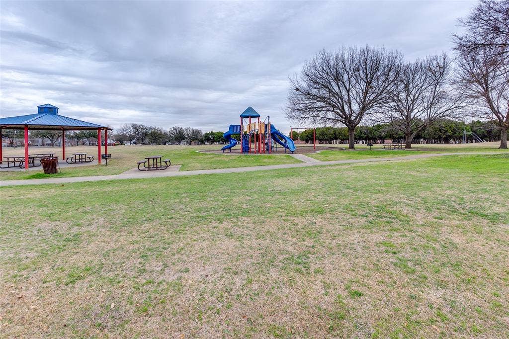 Community play area featuring a yard, a gazebo, and a patio