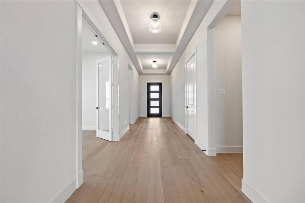 1571 Temple Court, Prosper, TX 75078 This stunning entry featuring glass & wood entry door, beautiful flooring and ample wall space for art work is the perfect place for you to welcome family and friends into your new dream home!