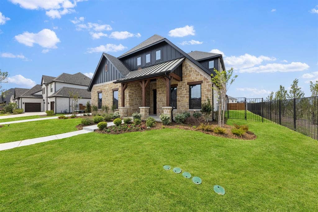 1571 Temple Court, Prosper, TX 75078 Featuring beautiful stone and brick paired with striking trim, this dream home offers outstanding curb appeal!