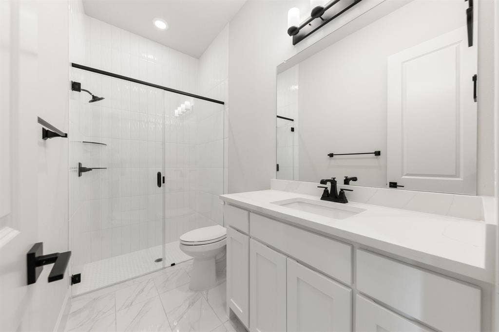1571 Temple Court, Prosper, TX 75078 Friends and family will feel right at home in any of the beautifully finished guest baths our Laithan plan offers.