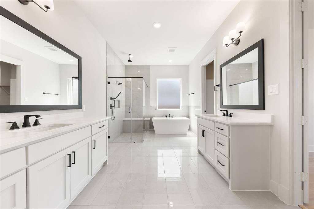 1571 Temple Court, Prosper, TX 75078 With beautiful finishes and plenty of space, this over the top owner's bath was designed with two in mind.