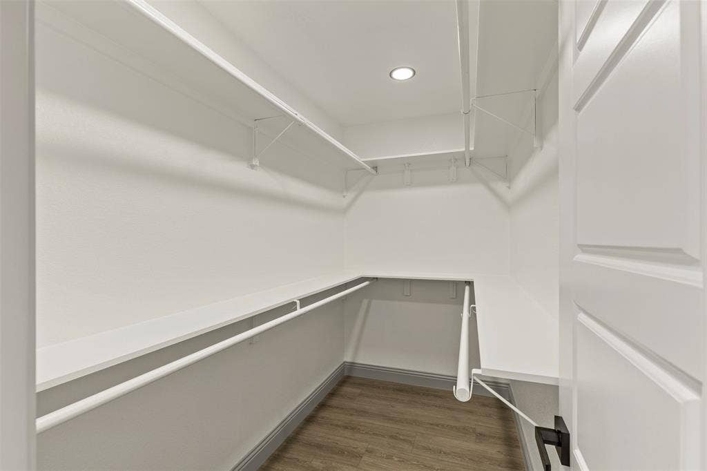 5619 Lake Granbury Trail, Granbury, TX 76048 Walk in closet with dark wood finished floors