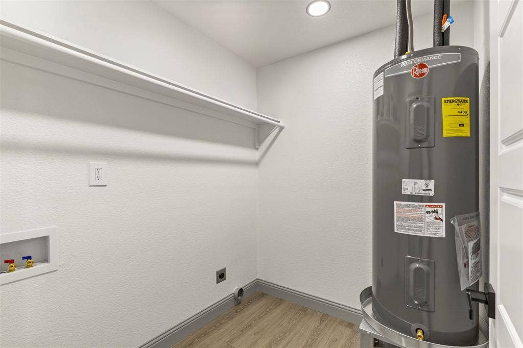5619 Lake Granbury Trail, Granbury, TX 76048 Utility room featuring electric water heater