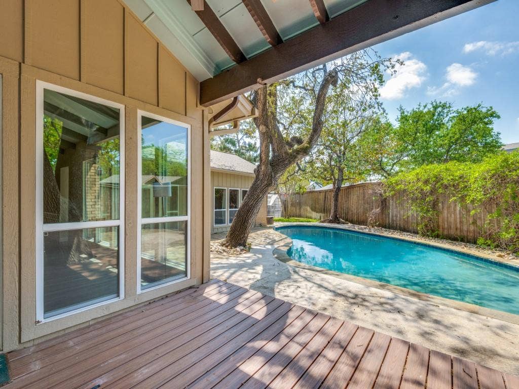 108 Wellesley Drive, Irving, TX 75062 View of swimming pool with a fenced backyard, a deck, and patio surround