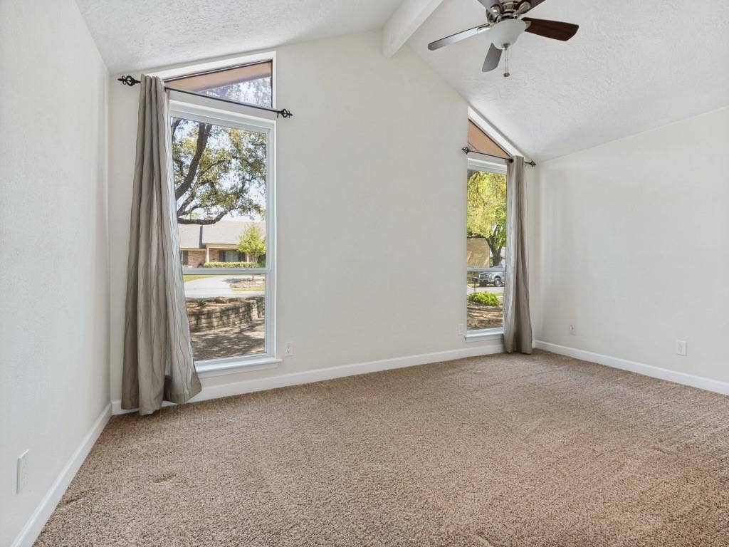 108 Wellesley Drive, Irving, TX 75062 Secondary bedroom featuring a textured ceiling, light carpet, ceiling fan, and beam ceiling