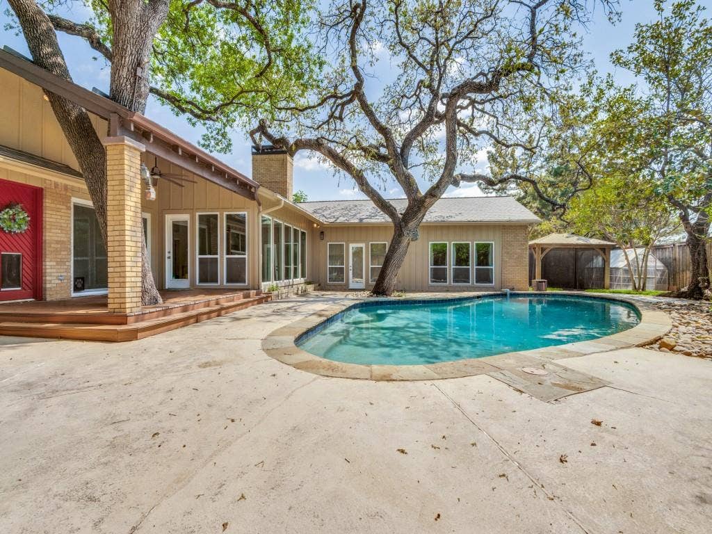 108 Wellesley Drive, Irving, TX 75062 View of swimming pool featuring patio surround and a gazebo