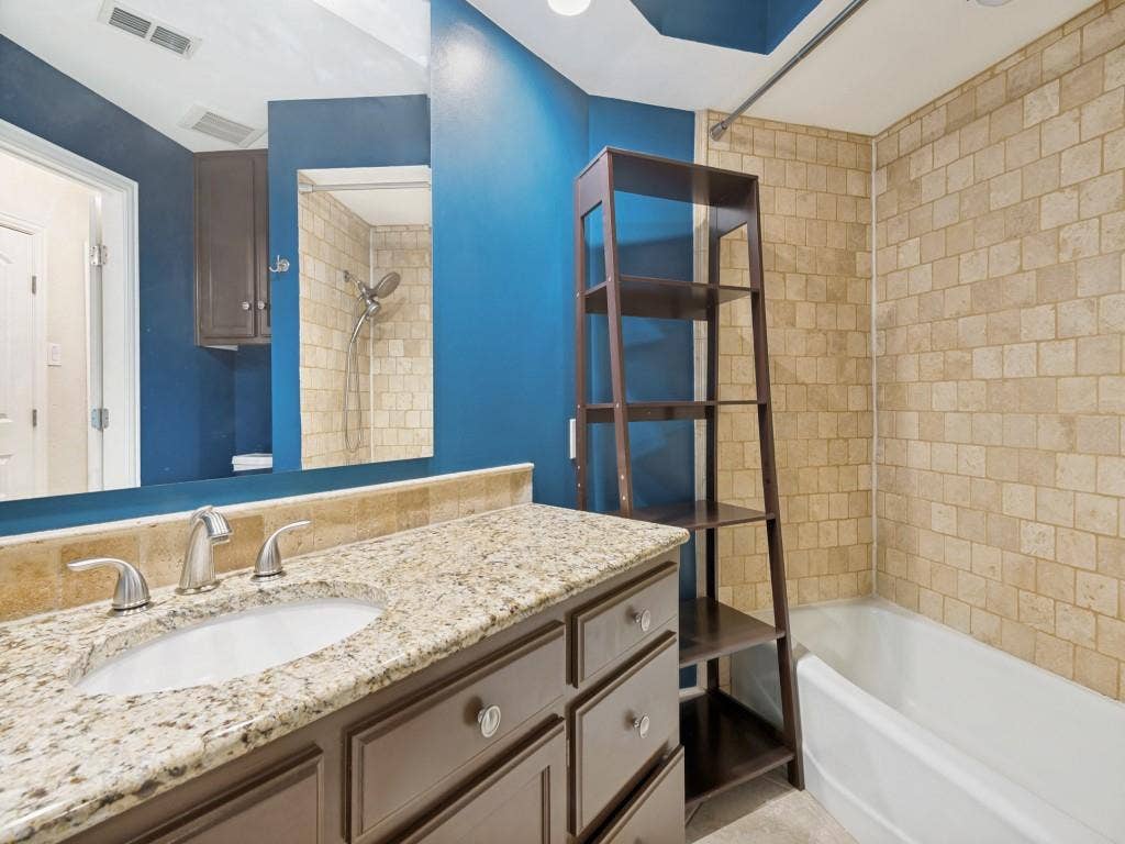 108 Wellesley Drive, Irving, TX 75062 Bathroom featuring shower / tub combination and vanity