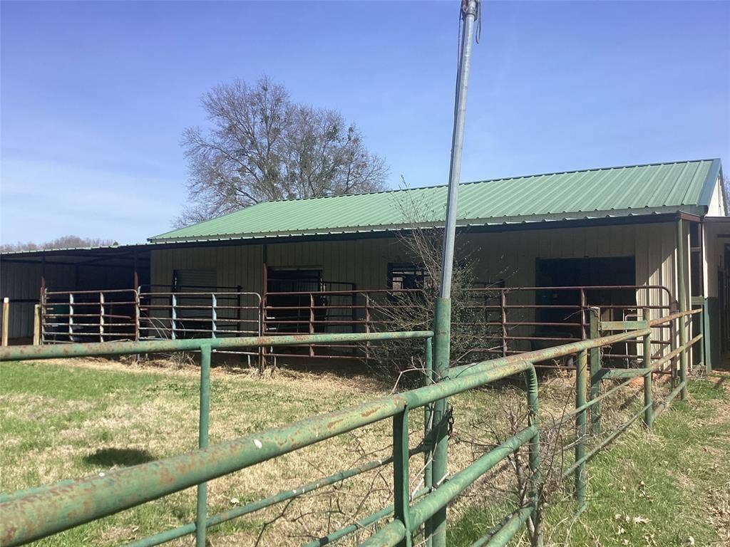 15314 Fm 3062, Malakoff, TX 75148 4 stalls includes extra room for feed storage plus tack room, storage room, and animal grooming room plumbed with hot and cold water.