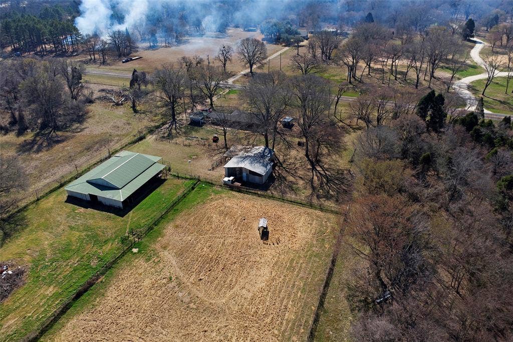 15314 Fm 3062, Malakoff, TX 75148 Barn, one acre fully fence small animal yard, auxillary storage attached to living quarters, trees canopy home Perspecive is 1st pasture to home