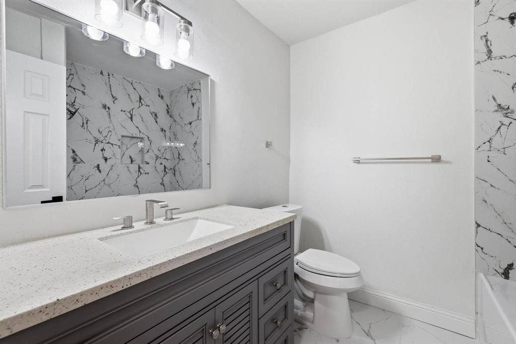 2211 Sierra Drive, Grapevine, TX 76051 Full bathroom with vanity and light marble finish flooring