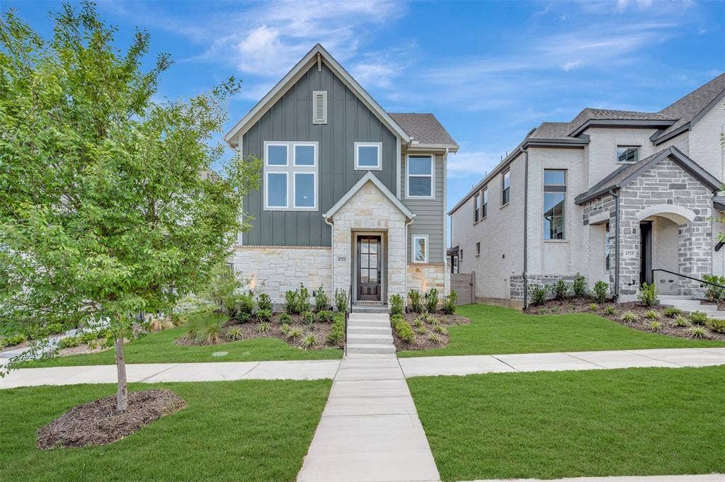 4721 Vizsla Lane, McKinney, TX 75071 Contemporary two-story residence featuring a stone and board-and-batten facade