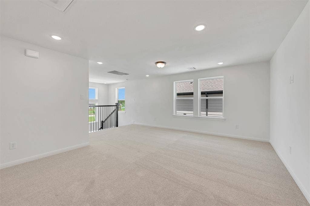 4721 Vizsla Lane, McKinney, TX 75071 Spacious upper-level room with neutral carpeting and white painted walls