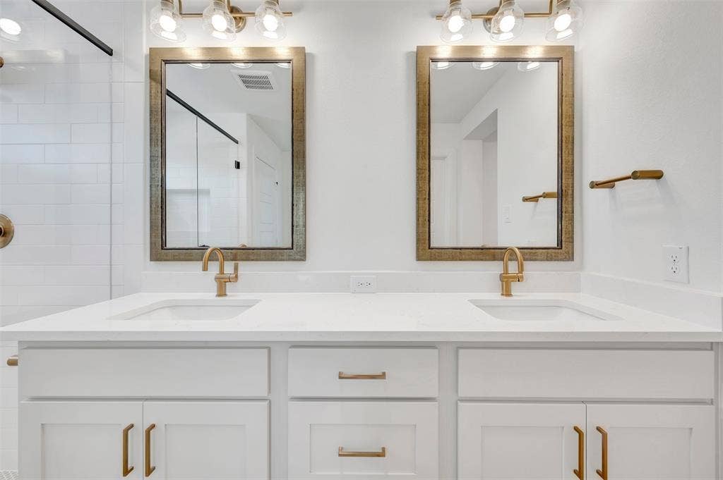 4721 Vizsla Lane, McKinney, TX 75071 Dual vanity with white cabinetry and integrated sinks