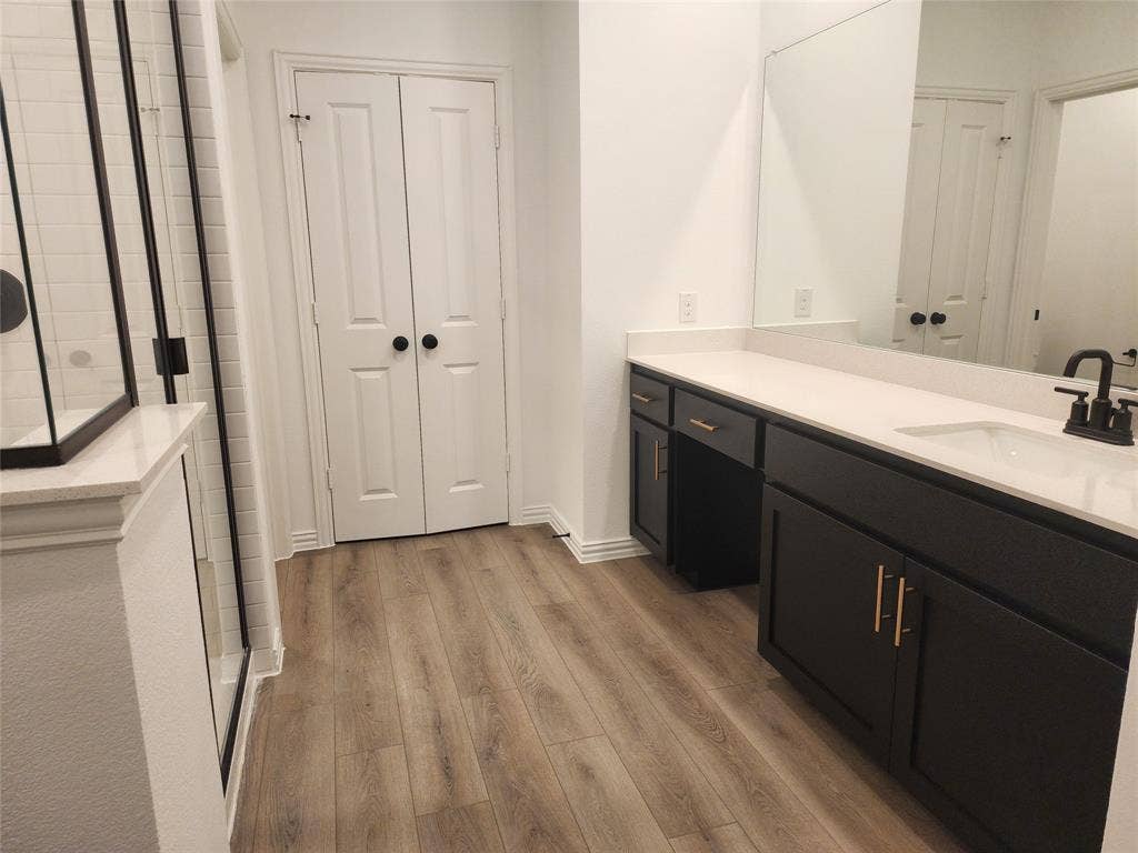 627 Redwood Way, Mansfield, TX 76063 Full bathroom featuring a closet, a stall shower, vanity, and light wood-type flooring
