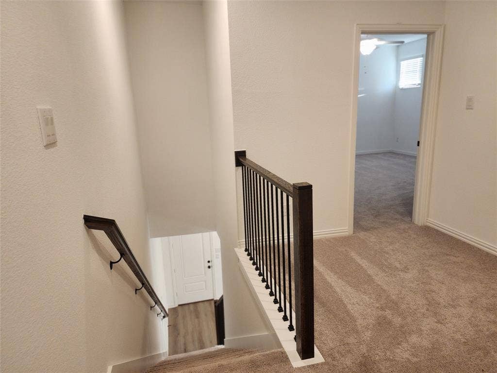 627 Redwood Way, Mansfield, TX 76063 Staircase featuring carpet floors and baseboards