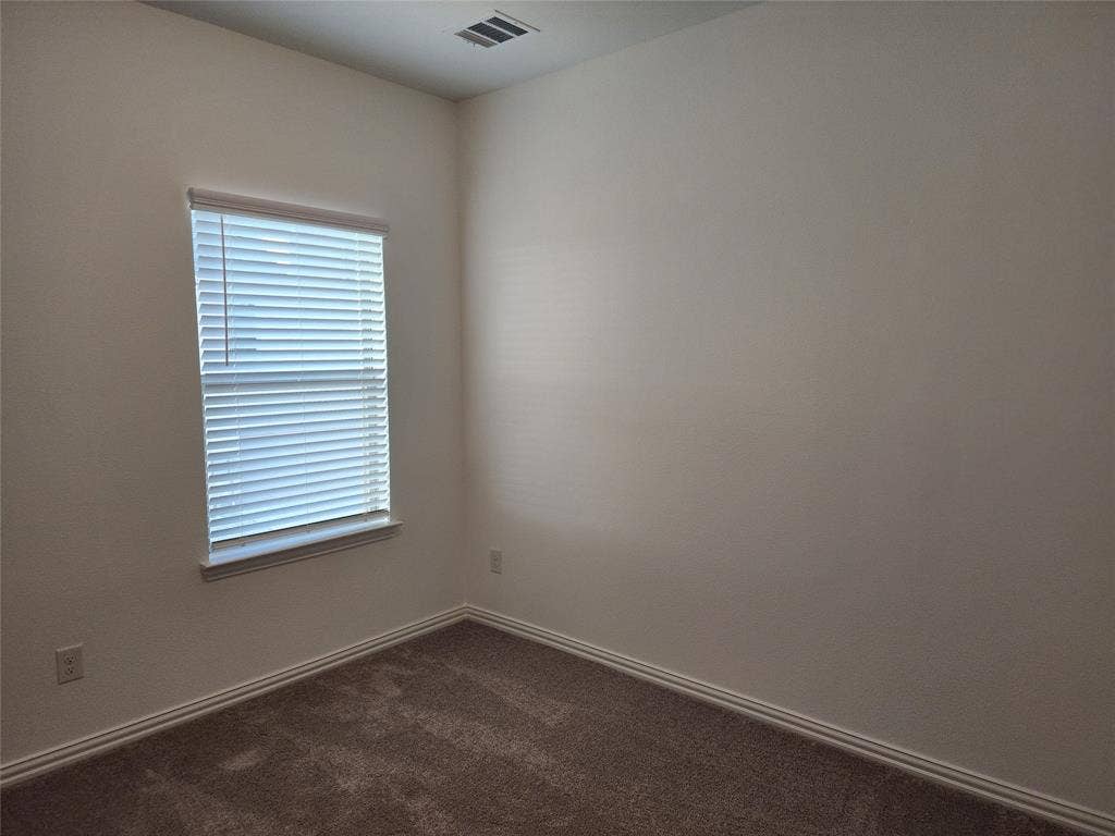 627 Redwood Way, Mansfield, TX 76063 Unfurnished room featuring dark carpet and baseboards