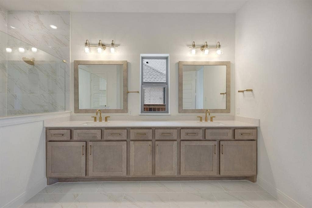 3283 Jersey Drive, Midlothian, TX 76065 Dual vanity featuring light wood-finish cabinetry, white countertops, and gold-toned fixtures