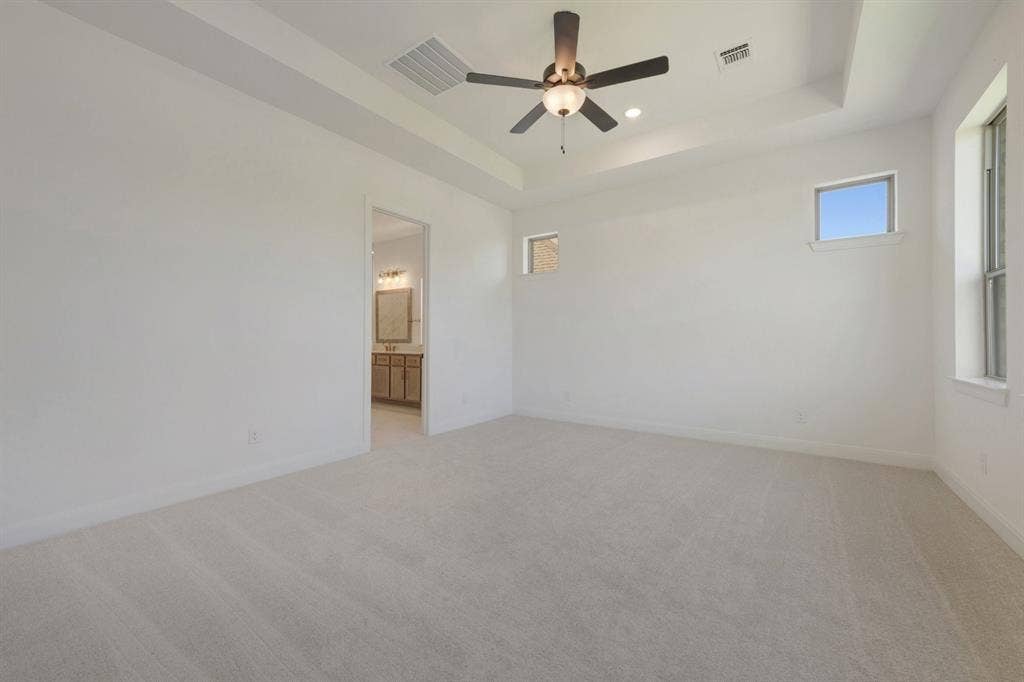 3283 Jersey Drive, Midlothian, TX 76065 Spacious room featuring light-toned carpeting and a tray ceiling