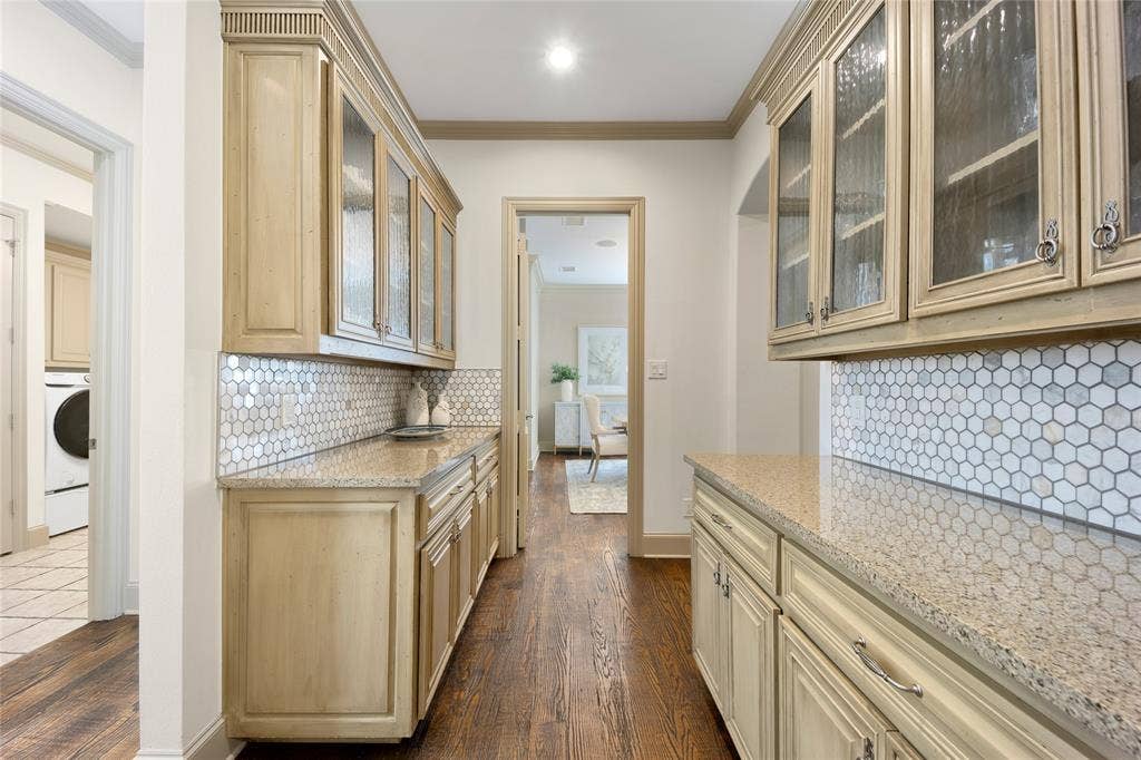 6615 Meadow Road, Dallas, TX 75230 Two butler pantries service the formal dining room and lies just outside of the kitchen. This is a perfect scenario for catering access through garage and/or for buffet set up on the 2 large countertops.