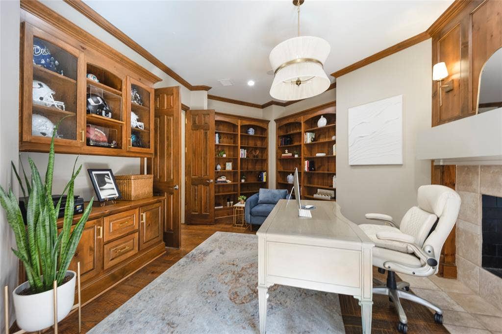 6615 Meadow Road, Dallas, TX 75230 Handsome library with built-ins, fireplace and private terrace just through the french doors.