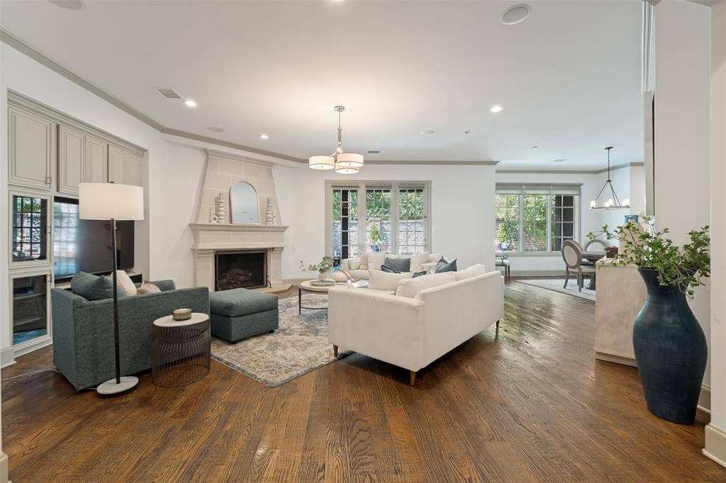 6615 Meadow Road, Dallas, TX 75230 A cozy fireplace and built in entertainment system.