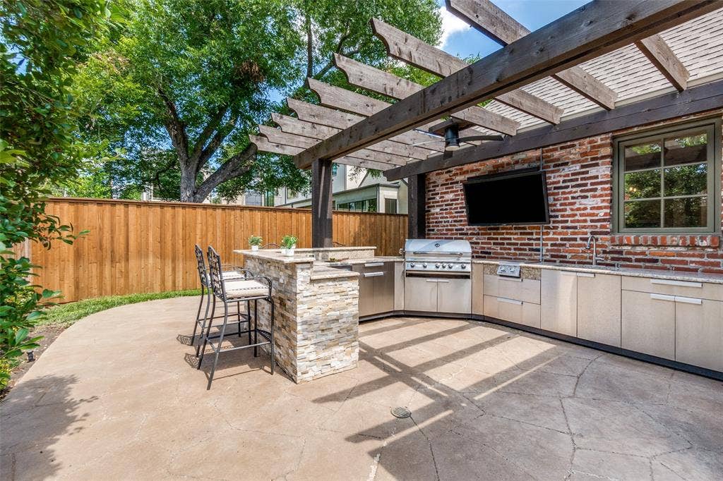 6615 Meadow Road, Dallas, TX 75230 Outdoor kitchen and pergola added in 2017.