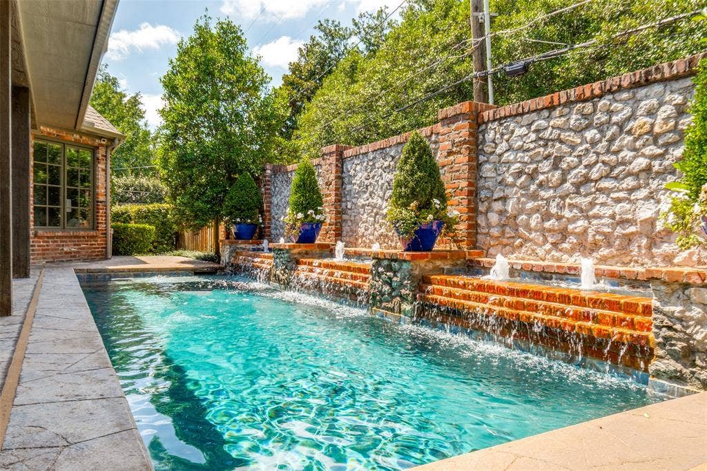 6615 Meadow Road, Dallas, TX 75230 The current owners replaced the tile and the plaster, added a heater stained the deck and added pergola and outdoor kitchen. All work and maintained weekly by Miller's Pools