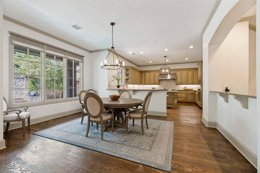 6615 Meadow Road, Dallas, TX 75230 The breakfast room enjoys large casement windows that let in an abundance of natural light.