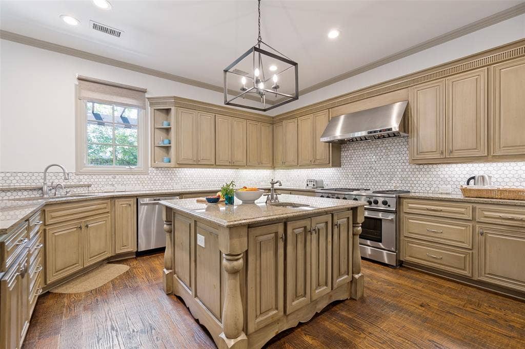 6615 Meadow Road, Dallas, TX 75230 The current owners updated the backsplash and new stainless applicances.