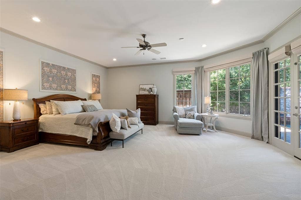 6615 Meadow Road, Dallas, TX 75230 The generous and private master suite enjoys views and direct access to the heated pool. Large casement windows and french doors provide an abundance of natural light. The custom wall panels can be personalized. The carpet is ultra plush underofoot.