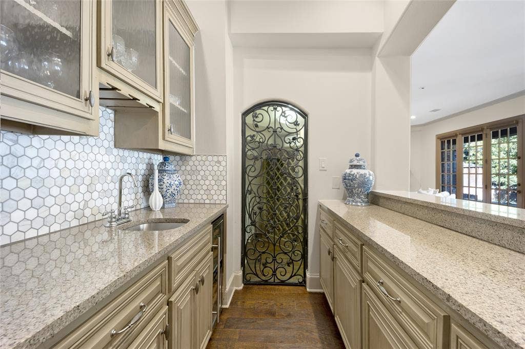6615 Meadow Road, Dallas, TX 75230 The wet bar has a chilled wine fridge and wine room with storage for your favorite vintages.
