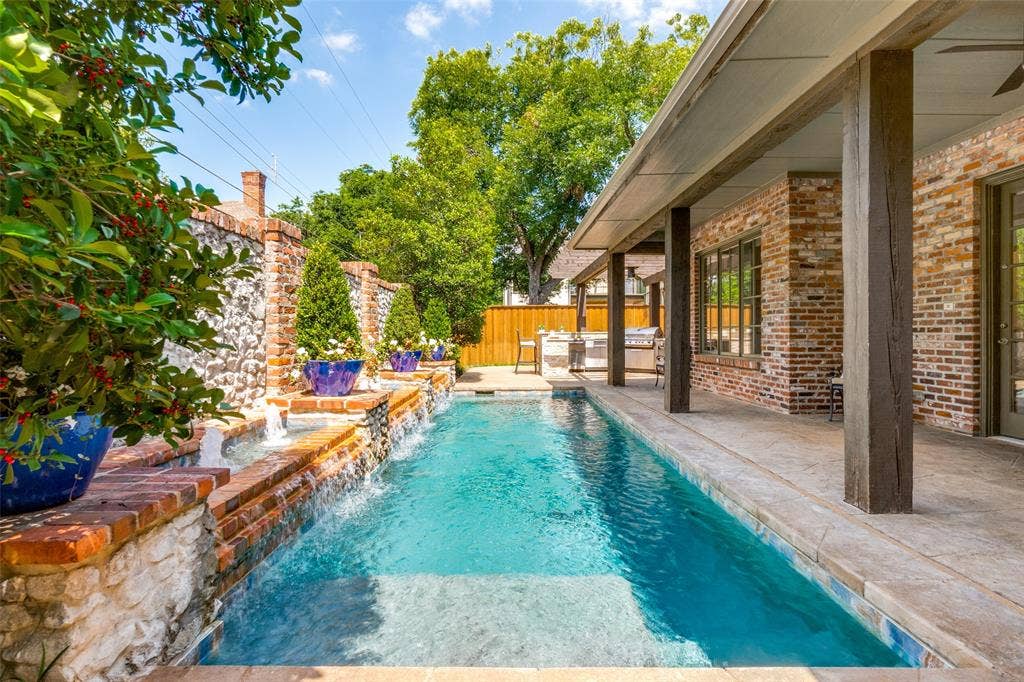 6615 Meadow Road, Dallas, TX 75230 The current owners replaced the tile and the plaster, added a heater stained the deck and added pergola and outdoor kitchen. All work and maintained weekly by Miller's Pools