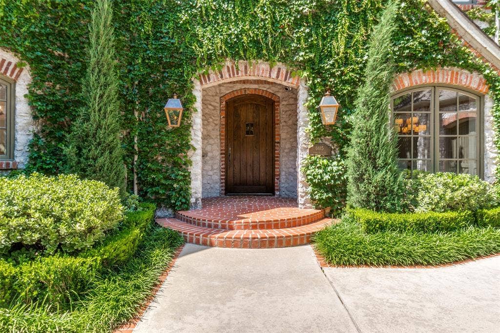 6615 Meadow Road, Dallas, TX 75230 Manicured ivy exterior with copper gas lanterns greet guests to the updated European transitional interiors of 6615 Meadow Rd. An incomparable drive up, reminiscent to the estates found on the East Coast.