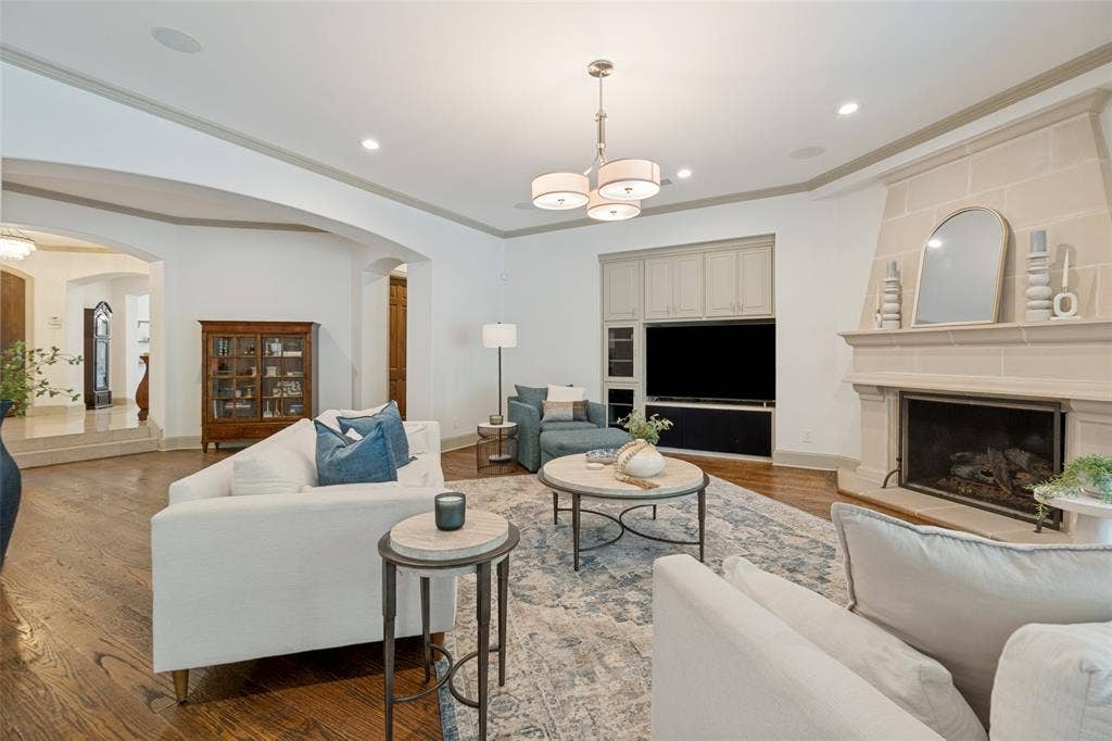 6615 Meadow Road, Dallas, TX 75230 A cozy fireplace and built in entertainment system.