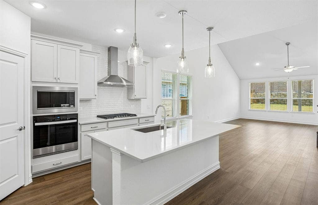 4725 Ripley Court, Celina, TX 75009 Kitchen with eat-in bartop island