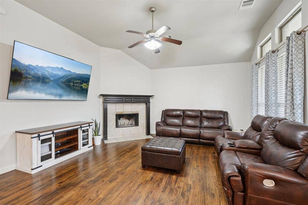 Living room featuring a wood burning fireplace