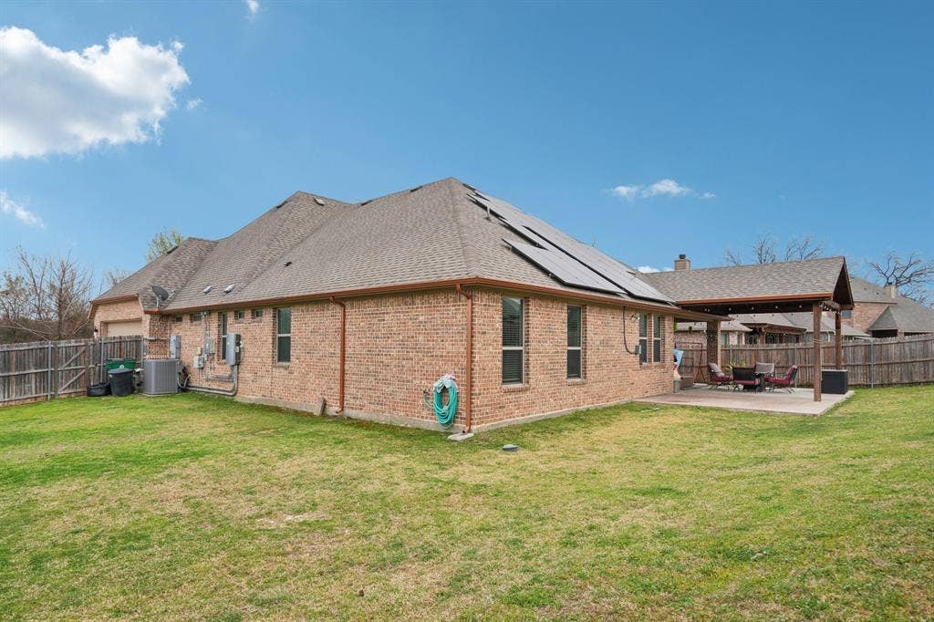 Home equipped with paid-off solar panels providing energy efficiency and long-term savings.