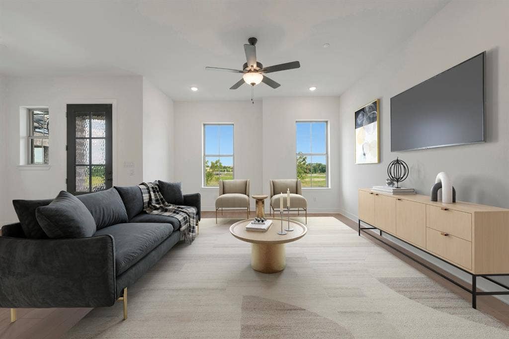 2852 Yampa Drive, McKinney, TX 75071 Spacious living area featuring light wood-finish flooring, recessed lighting, and a ceiling fan